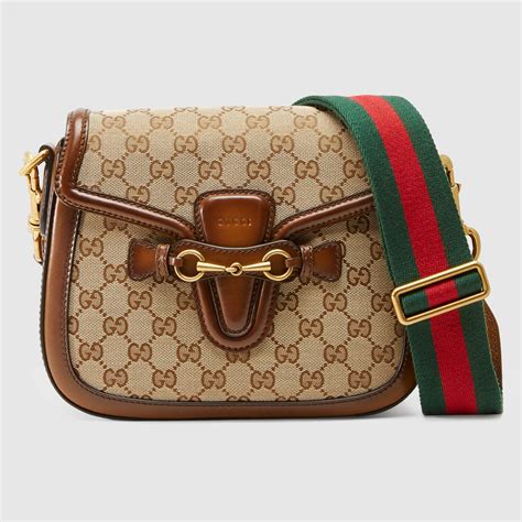 gucci canvas shoulder bag on person|cheapest Gucci shoulder bag.